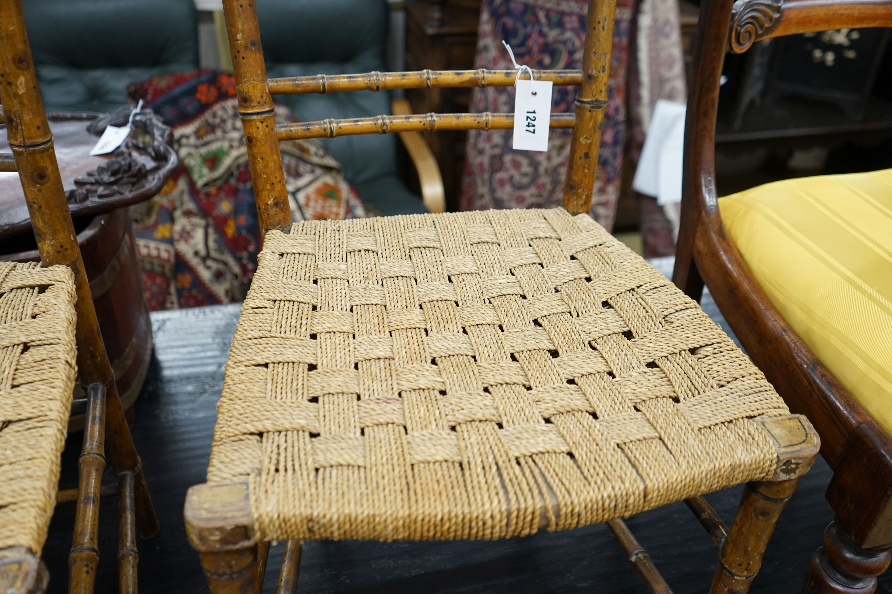 A pair of Regency faux bamboo cane seated chairs